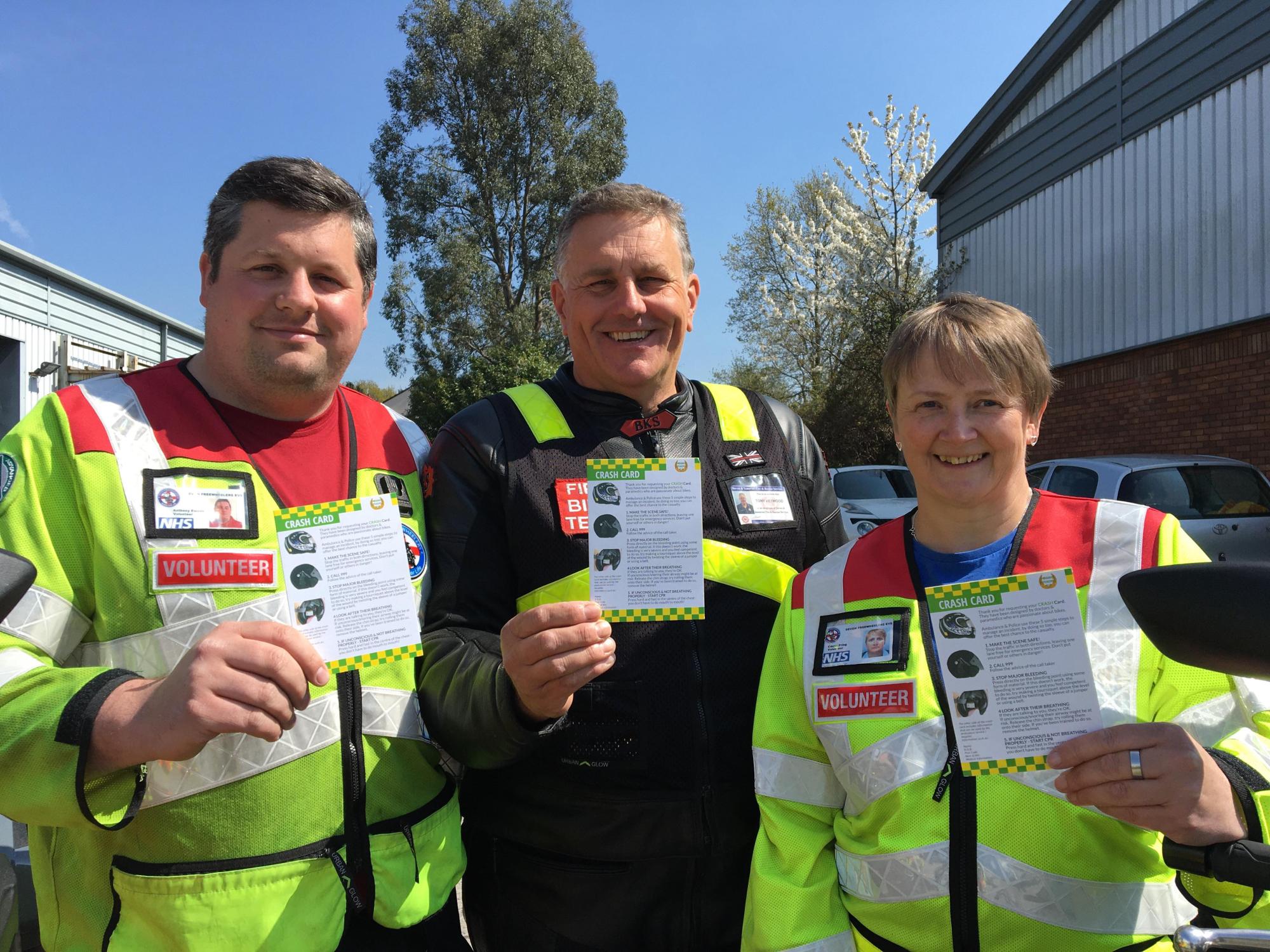 Devon Freewheelers volunteers receive the Crash Cards on behalf of the charity