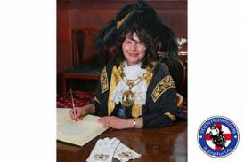 Lord Mayor signing paper