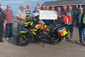 The Royal Antediluvian Order of Buffaloes' (Buffs) of Beer brothers presenting the cheque for £3,000 to the Devon Freewheelers. Photo: Buffs of Beer.