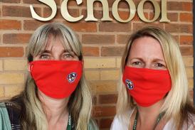 Staff at St Joseph's Catholic Primary School with their Devon Freewheelers face masks