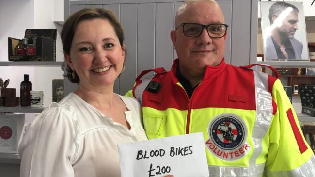 Pictured here is Jenny Lane presenting the £200 donation to Russell Roe, Devon Freewheelers CEO. Photo: Devon Freewheelers.