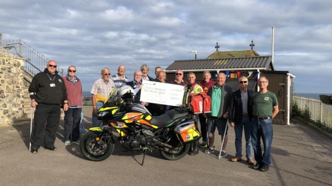 The Royal Antediluvian Order of Buffaloes' (Buffs) of Beer brothers presenting the cheque for £3,000 to the Devon Freewheelers. Photo: Buffs of Beer.